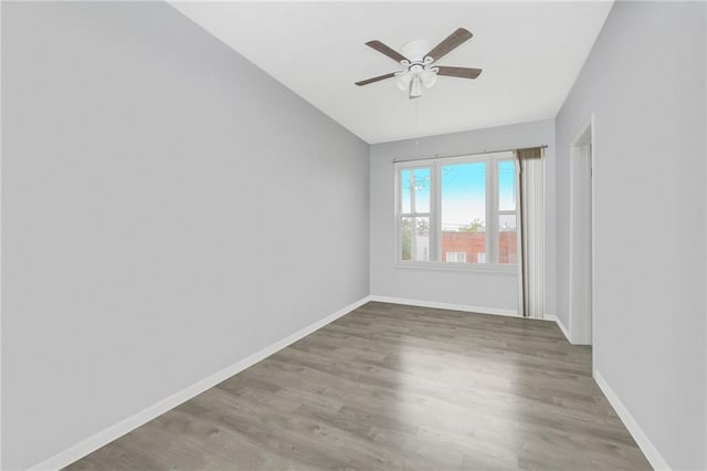 1113 68th St, Brooklyn, NY 11219 - spare room with vaulted ceiling, a ceiling fan, wood finished floors, and baseboards