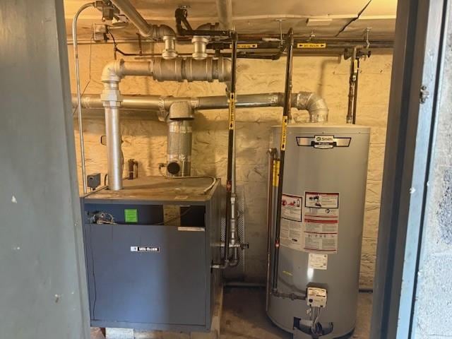 1113 68th St, Brooklyn, NY 11219 - utility room featuring water heater and a heating unit