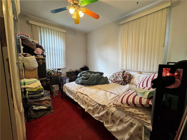 bedroom with carpet floors and a ceiling fan