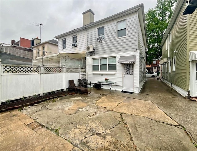 2291 E 21st St, Brooklyn, NY 11229 - back of house with a patio area, cooling unit, and a chimney