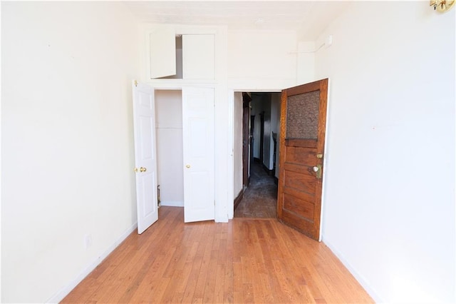 642 56th St, Brooklyn, NY 11220 - unfurnished bedroom with light wood-type flooring and baseboards