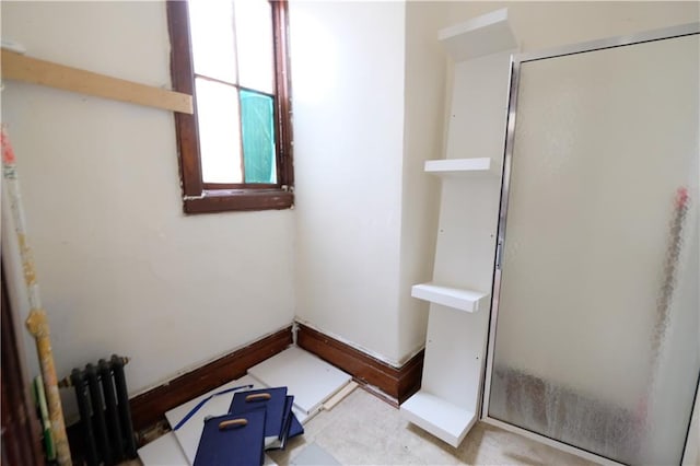 642 56th St, Brooklyn, NY 11220 - full bathroom with a stall shower, radiator, and baseboards