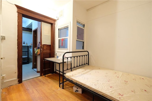 642 56th St, Brooklyn, NY 11220 - bedroom featuring light wood finished floors