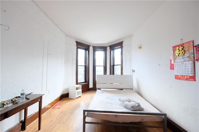 642 56th St, Brooklyn, NY 11220 - bedroom with light wood-style floors and baseboards
