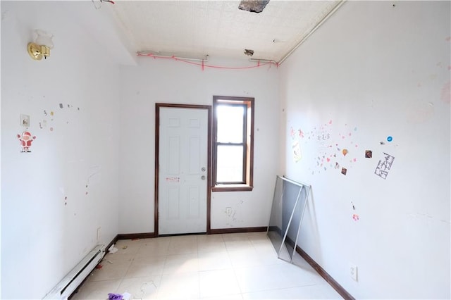 642 56th St, Brooklyn, NY 11220 - spare room featuring a baseboard heating unit and baseboards