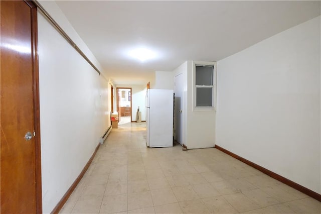 642 56th St, Brooklyn, NY 11220 - hallway with baseboards and a baseboard heating unit