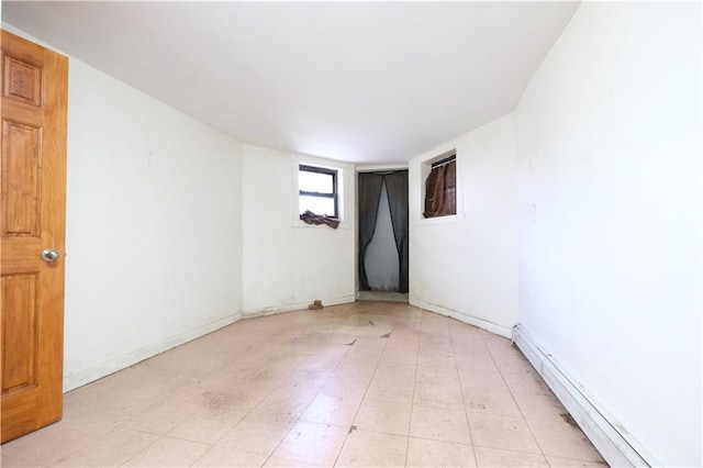 642 56th St, Brooklyn, NY 11220 - spare room with a baseboard heating unit and baseboards