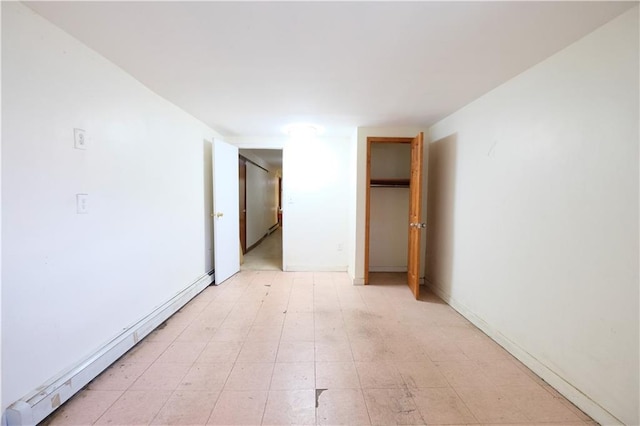 642 56th St, Brooklyn, NY 11220 - unfurnished room featuring a baseboard heating unit, light flooring, and baseboards