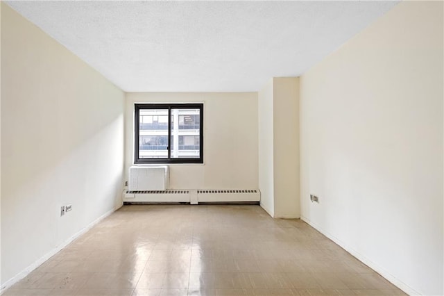 333 Pearl St Unit 8E, New York, NY 10038 - spare room featuring a baseboard heating unit, a wall mounted AC, and a textured ceiling