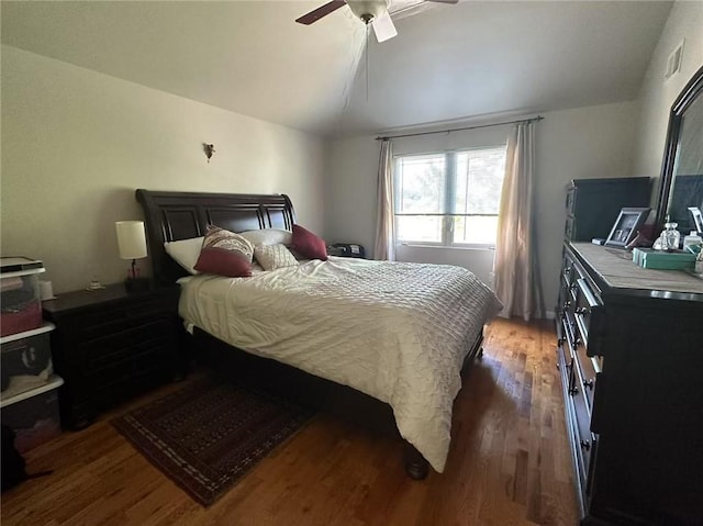 bedroom featuring vaulted ceiling, light wood-style flooring, and ceiling fan