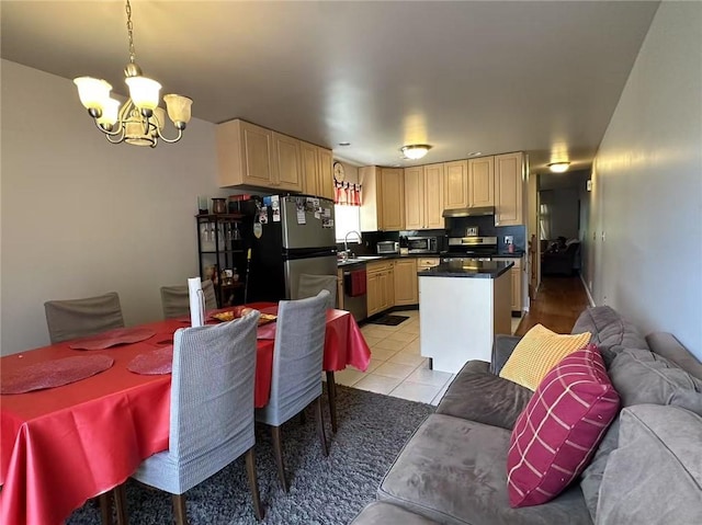 357 Cromwell Ave, Staten Island, NY 10305 - kitchen featuring appliances with stainless steel finishes, a chandelier, under cabinet range hood, a sink, and light tile patterned floors