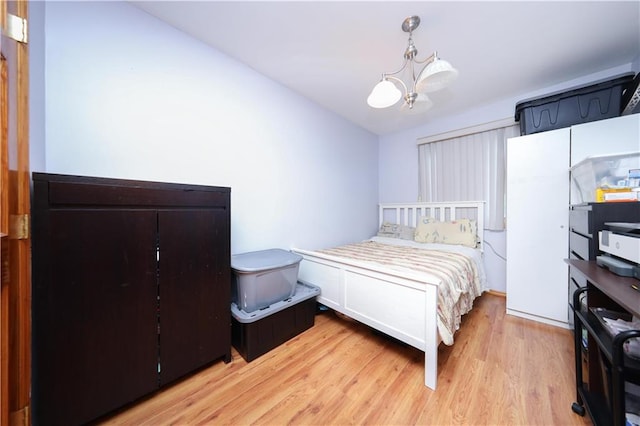 97 Debbie St Unit 97, Staten Island, NY 10314 - bedroom featuring a chandelier and light wood-style floors