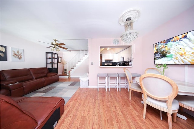 97 Debbie St Unit 97, Staten Island, NY 10314 - living area with stairway, wood finished floors, and a ceiling fan