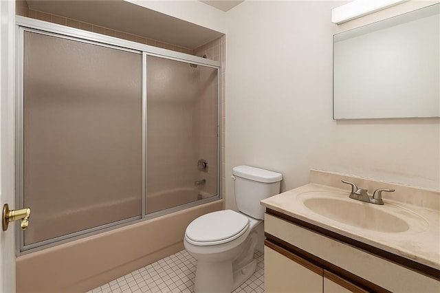 full bath featuring tile patterned floors, bath / shower combo with glass door, toilet, and vanity