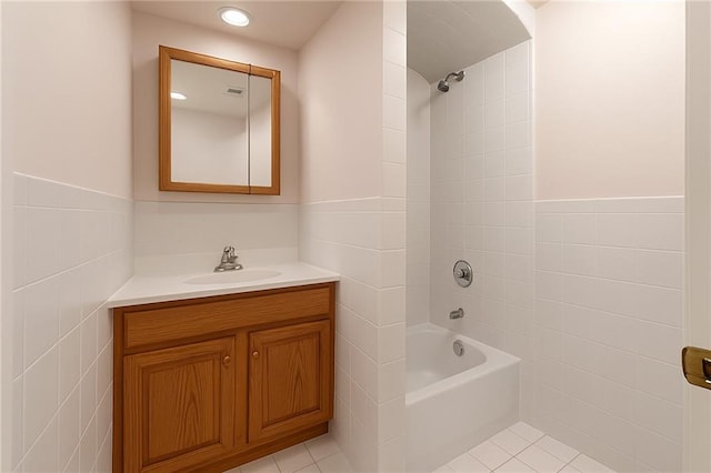 full bathroom with tile walls, tub / shower combination, vanity, and recessed lighting