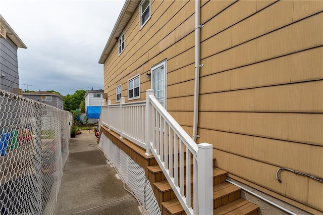 view of home's exterior with fence