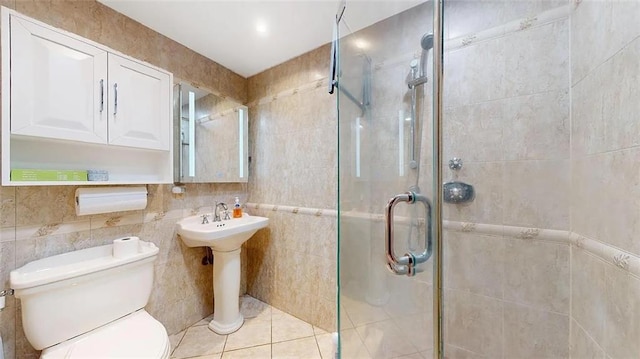 2421 Ocean Ave Unit 7A, Brooklyn, NY 11229 - full bath featuring a shower stall, toilet, tile walls, tile patterned flooring, and a sink