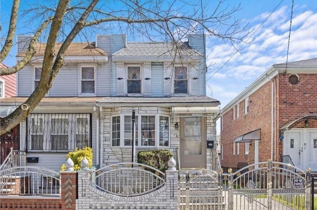1505 E 54th St, Brooklyn, NY 11234 - view of front of house featuring a gate, a fenced front yard, and a chimney