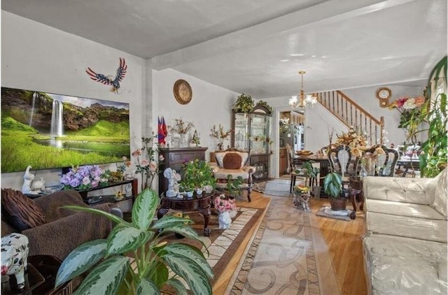 1505 E 54th St, Brooklyn, NY 11234 - living area with wood finished floors, a chandelier, and stairs