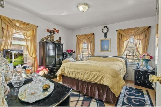 1505 E 54th St, Brooklyn, NY 11234 - bedroom featuring multiple windows and wood finished floors