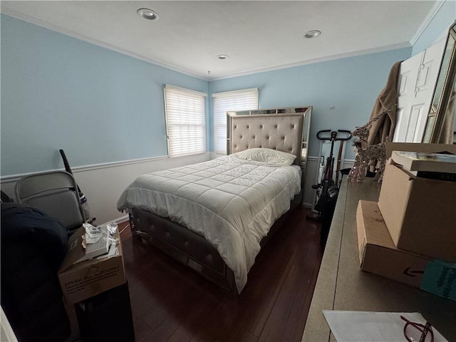 bedroom with dark wood finished floors, crown molding, and recessed lighting