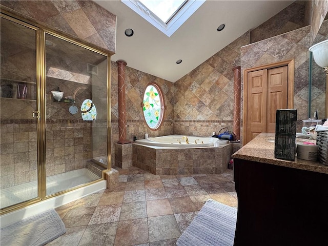 full bathroom with a bath, a stall shower, tile walls, a skylight, and recessed lighting