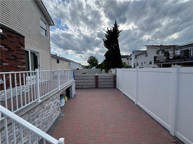 view of patio featuring fence