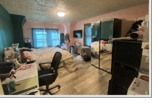 19907 100th Ave, Hollis, NY 11423 - office space featuring a textured ceiling and wood finished floors