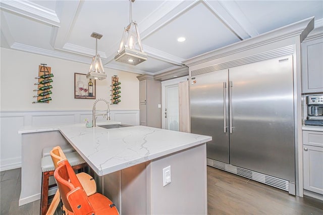 30-30 78th St, Queens, NY 11370 - kitchen with stainless steel built in refrigerator, ornamental molding, a sink, coffered ceiling, and light stone countertops