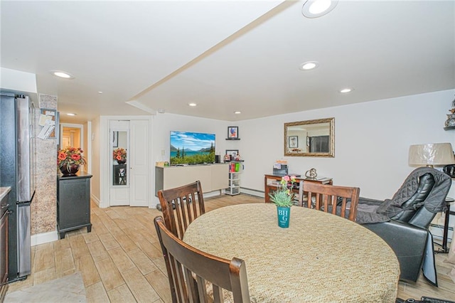 30-30 78th St, Queens, NY 11370 - dining area with light wood finished floors, recessed lighting, and baseboards