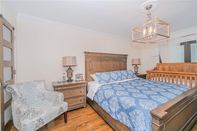 30-30 78th St, Queens, NY 11370 - bedroom with crown molding, wood finished floors, and a chandelier
