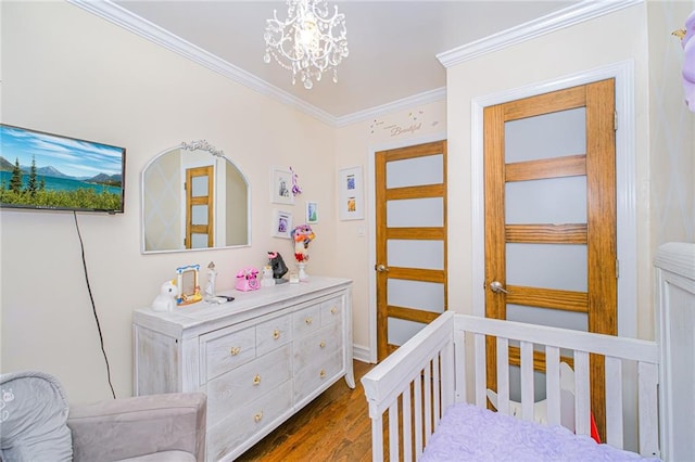 30-30 78th St, Queens, NY 11370 - bedroom with dark wood-style floors, crown molding, and a chandelier