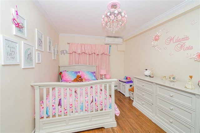 30-30 78th St, Queens, NY 11370 - bedroom with a wall unit AC, crown molding, and light wood-style floors