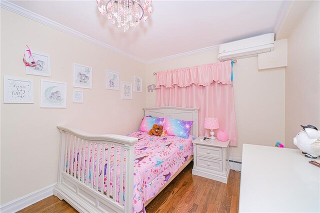 30-30 78th St, Queens, NY 11370 - bedroom featuring a wall mounted air conditioner, ornamental molding, wood finished floors, a baseboard radiator, and a chandelier