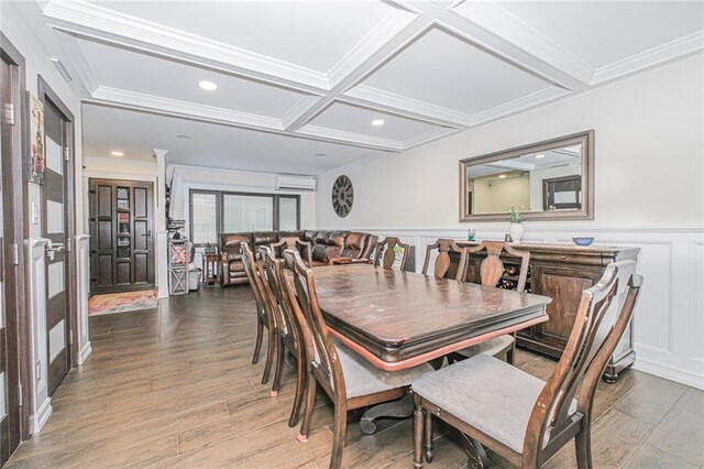 30-30 78th St, Queens, NY 11370 - dining area featuring a wall mounted air conditioner, wood finished floors, coffered ceiling, crown molding, and a wainscoted wall