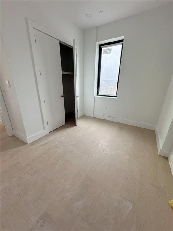 816 58th St Unit 8A, Brooklyn, NY 11220 - unfurnished bedroom featuring baseboards