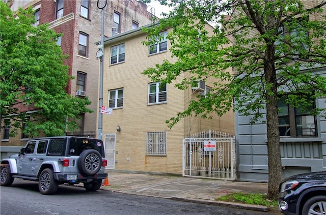 view of property featuring uncovered parking