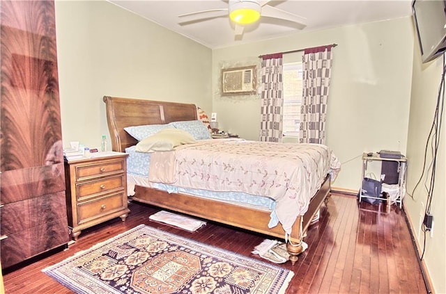 bedroom with hardwood / wood-style floors and a ceiling fan