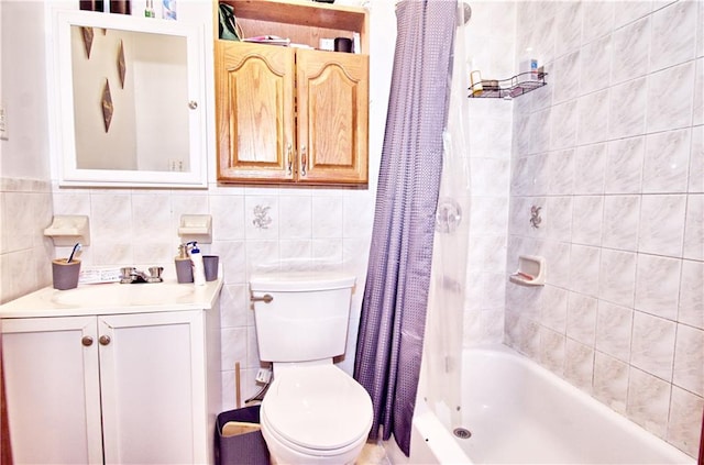 full bath with toilet, shower / bathtub combination with curtain, tile walls, and vanity
