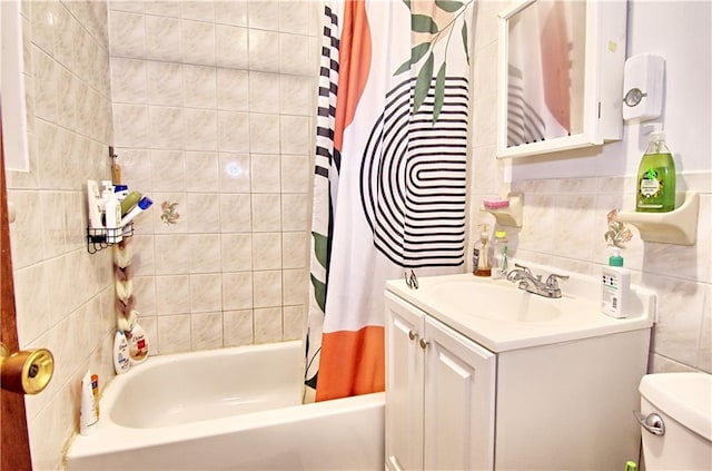 bathroom featuring vanity, shower / bath combo with shower curtain, and toilet