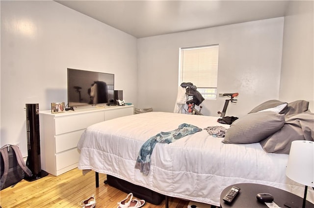 bedroom with light wood finished floors