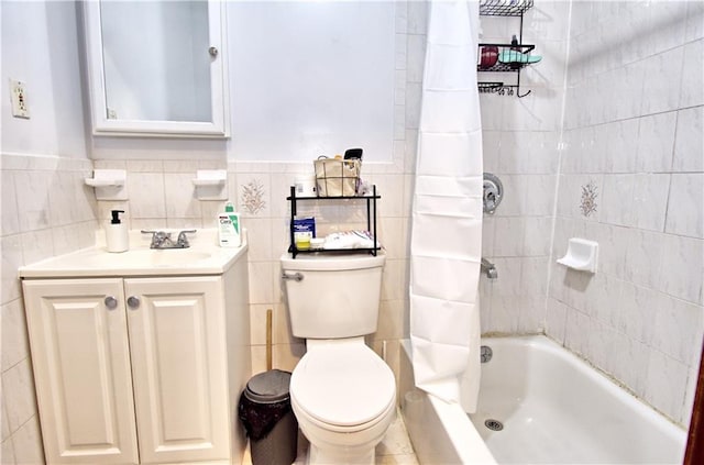 651 E 21st St, Brooklyn, NY 11226 - full bath with tile walls, toilet, vanity, shower / tub combo with curtain, and wainscoting