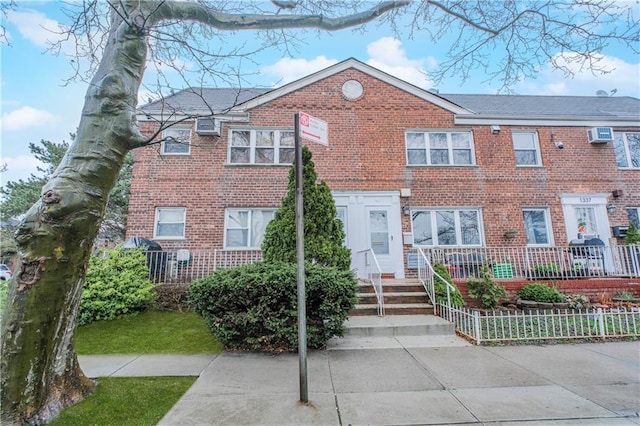 1333 Shore Pkwy Unit A, Brooklyn, NY 11214 - view of property featuring brick siding and an AC wall unit