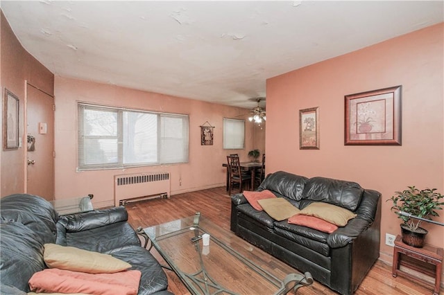 1333 Shore Pkwy Unit A, Brooklyn, NY 11214 - living area featuring radiator heating unit, wood finished floors, and ceiling fan