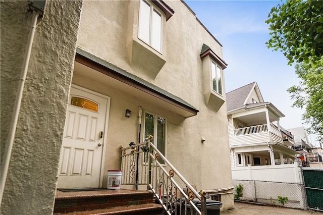 doorway to property with stucco siding