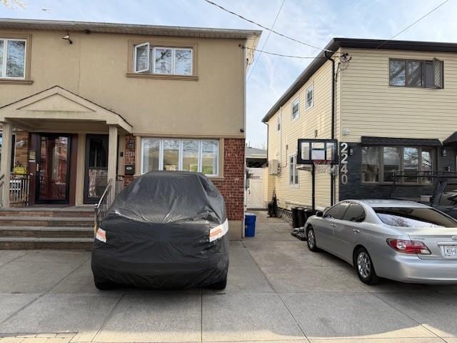 2244 E 59th Pl, Brooklyn, NY 11234 - rear view of house featuring stucco siding