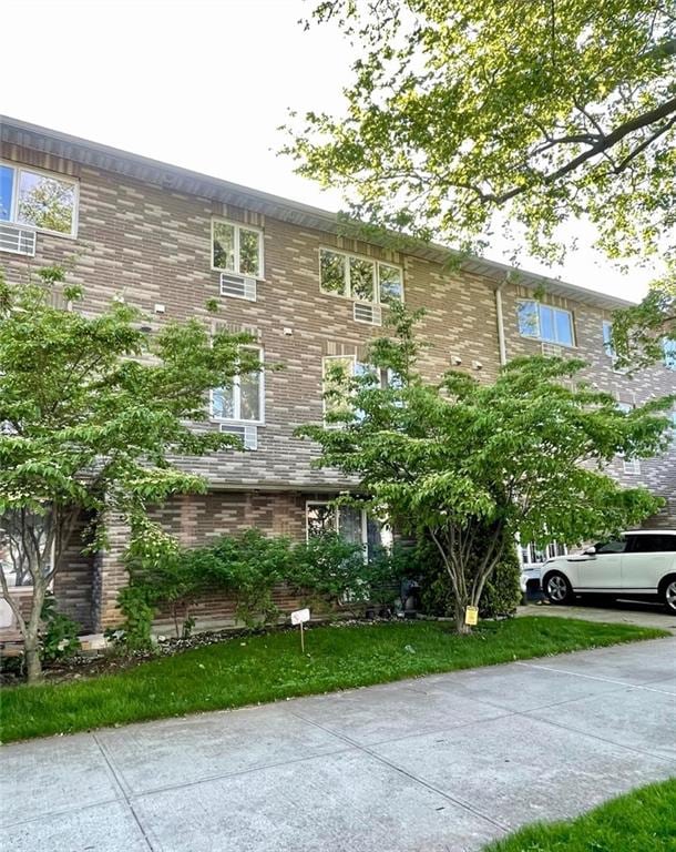 2536 E 1st St Unit 102, Brooklyn, NY 11223 - view of front of home featuring brick siding