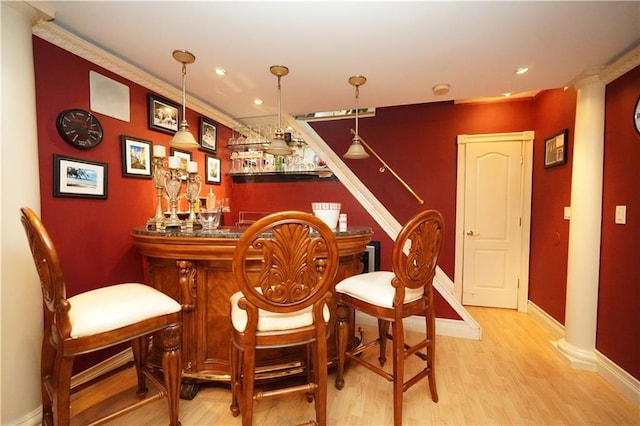48 Draper Pl, New Springville, NY 10314 - indoor dry bar featuring baseboards, wood finished floors, decorative columns, recessed lighting, and decorative light fixtures