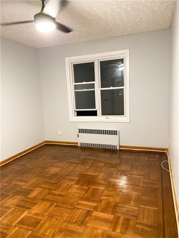 156 E 88th St, Brooklyn, NY 11236 - empty room with radiator, a ceiling fan, and a textured ceiling