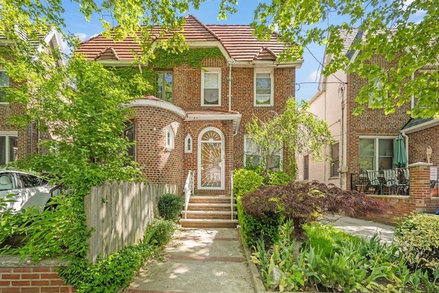 2117 E 38th St, Brooklyn, NY 11234 - view of front of property featuring brick siding and a tiled roof